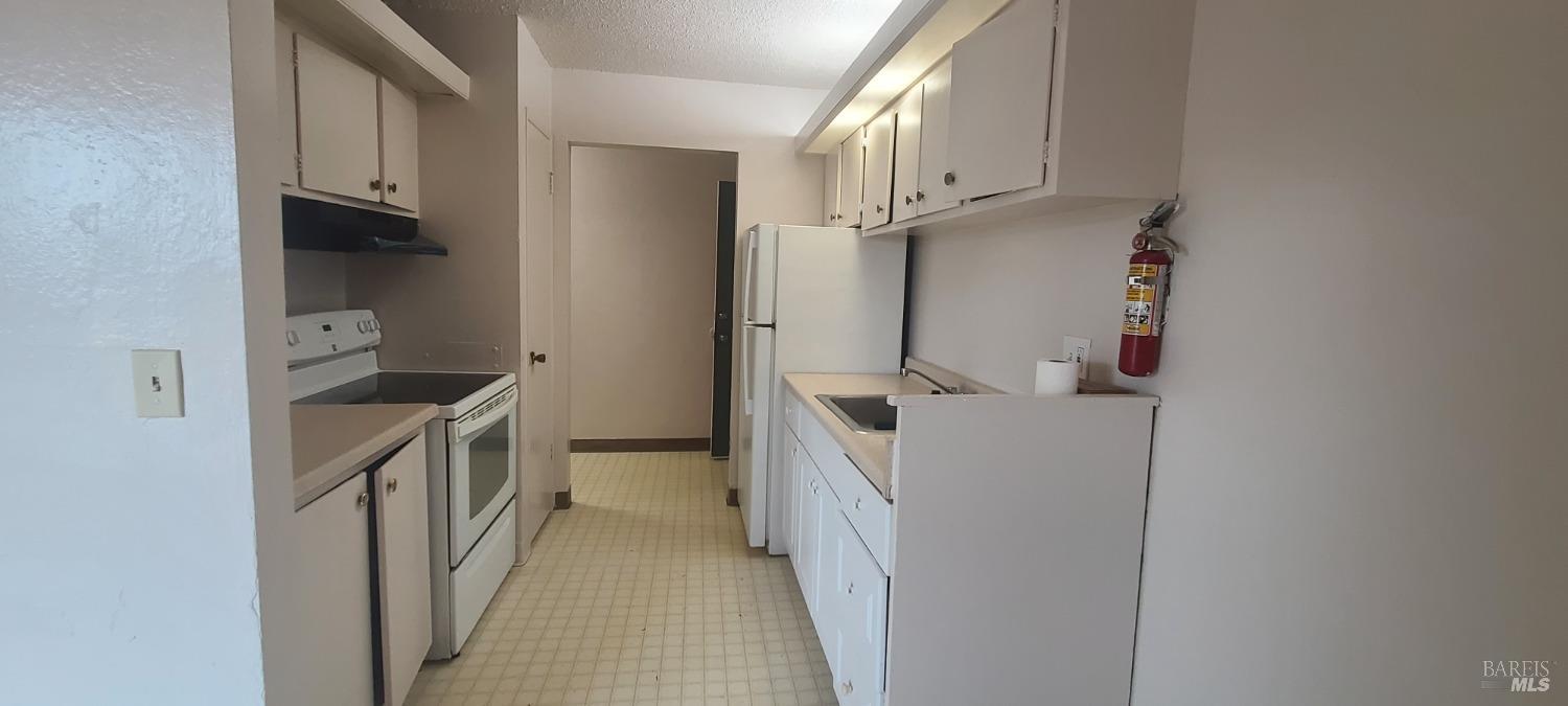 a view of a storage & utility room with washer and dryer