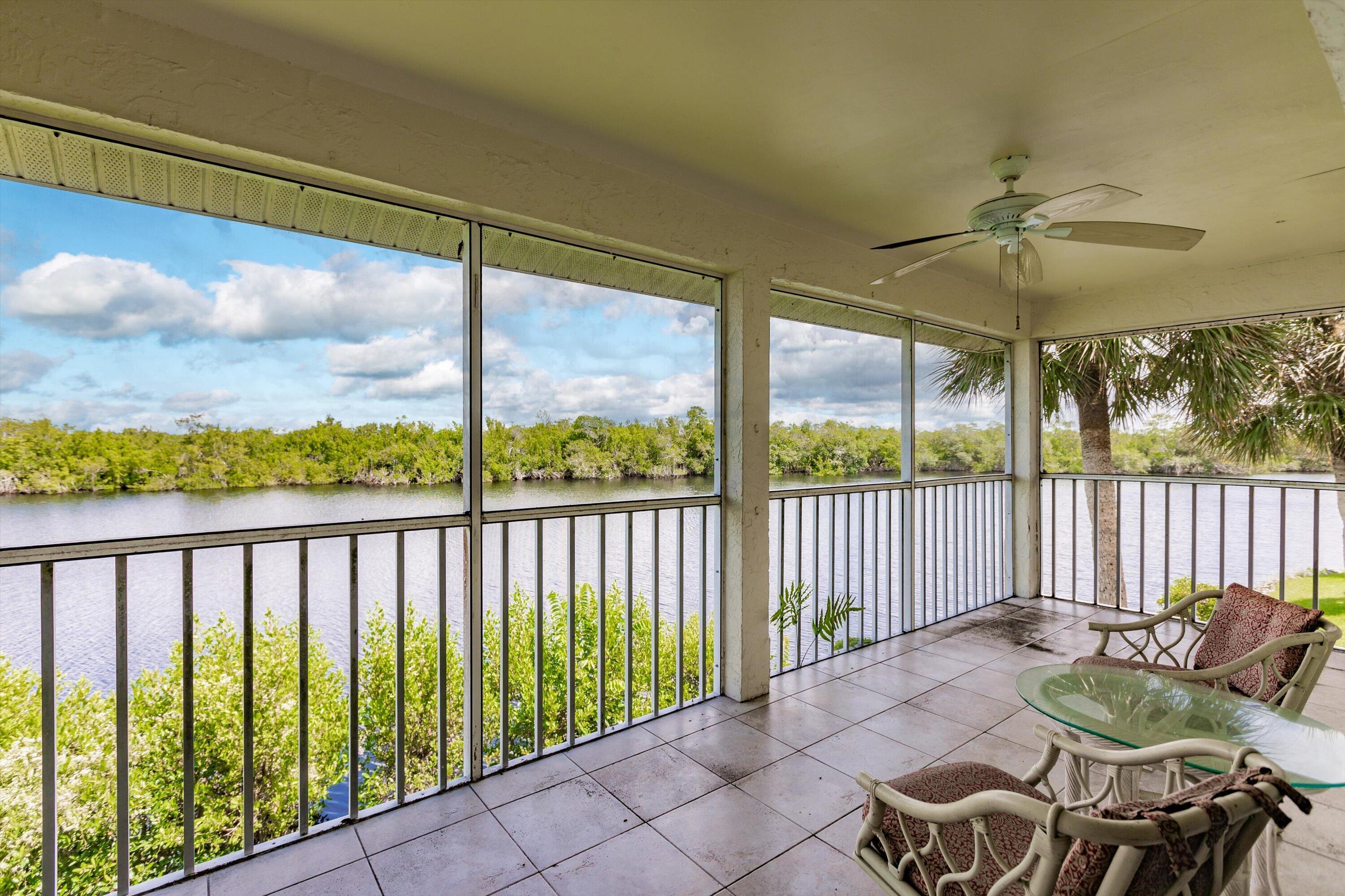 a balcony with table and chairs