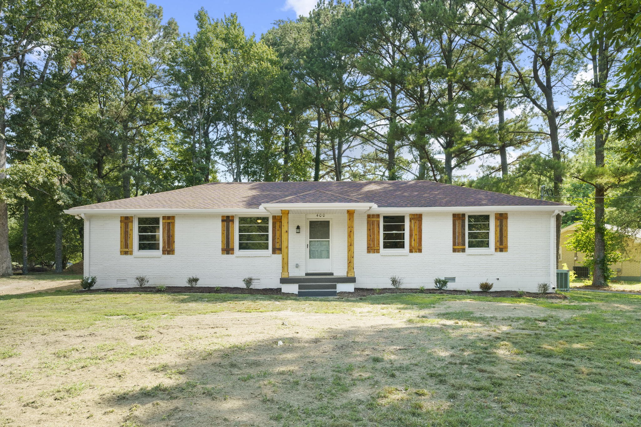 a view of a house with a yard