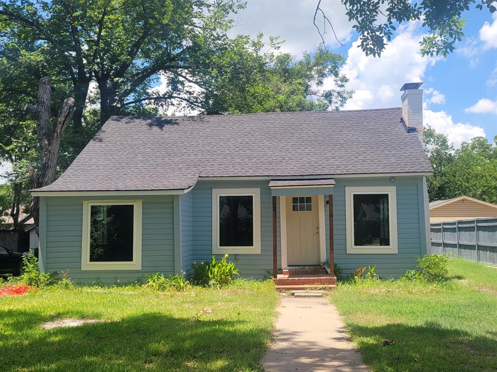 front view of a house with a yard