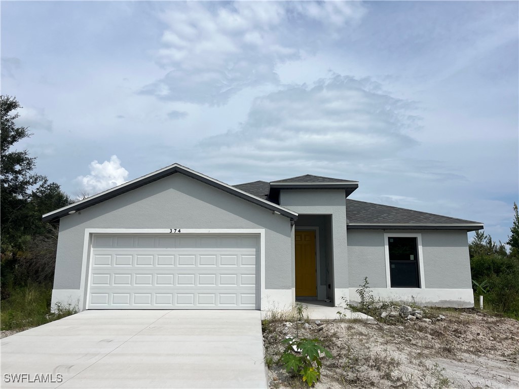 a front view of a house with a garage