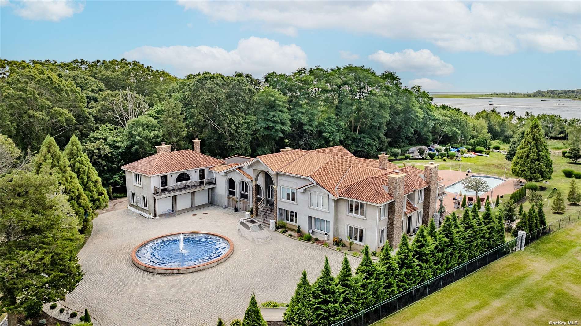 an aerial view of a house with garden space and street view