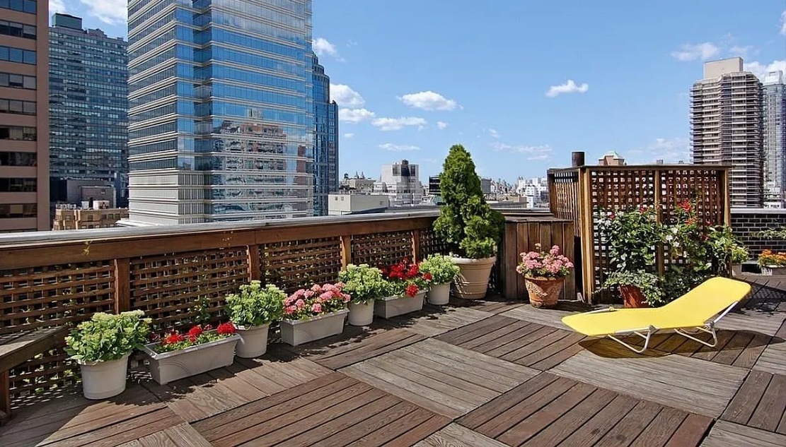 a view of a chairs on the roof deck