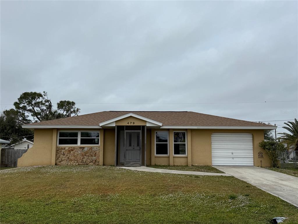 front view of a house with a yard