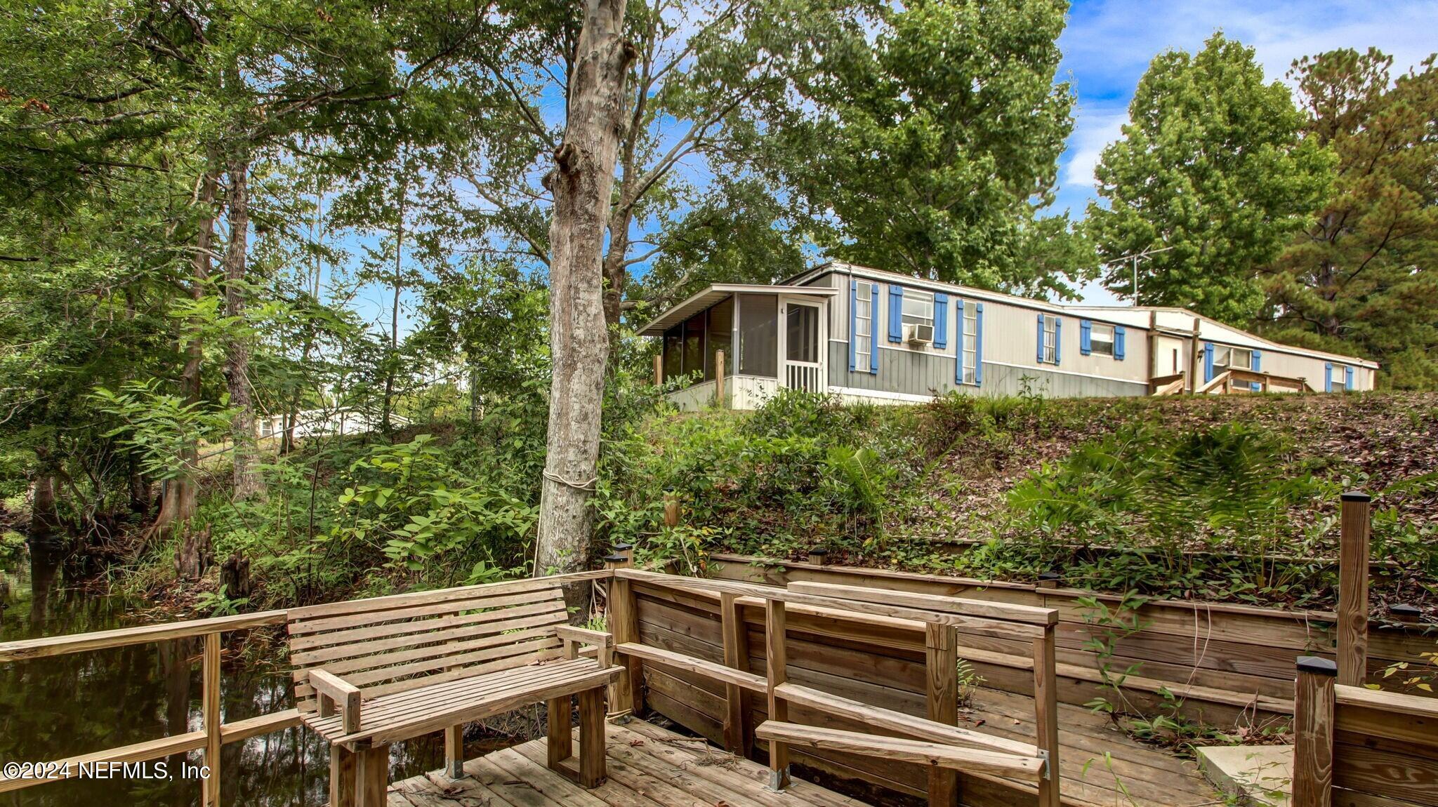 a front view of a house with trees