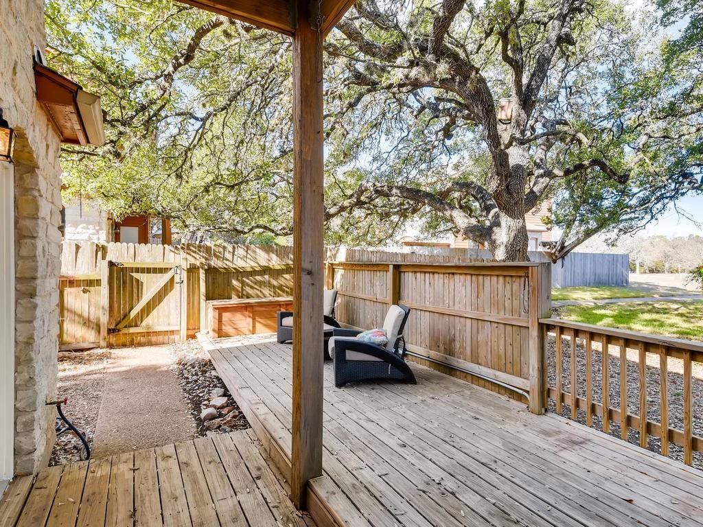 a view of a living room and wooden deck