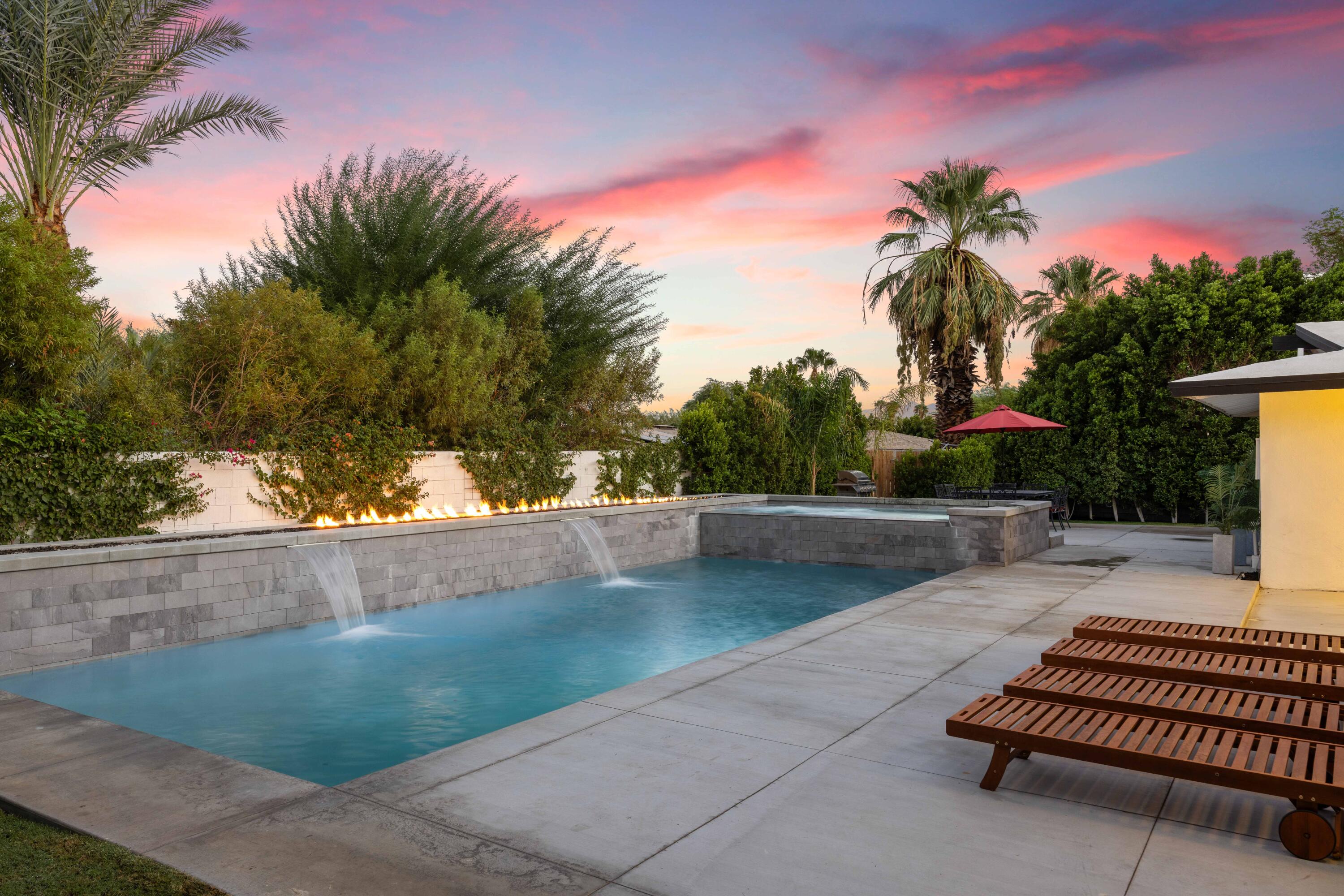 a view of swimming pool with lounge chair