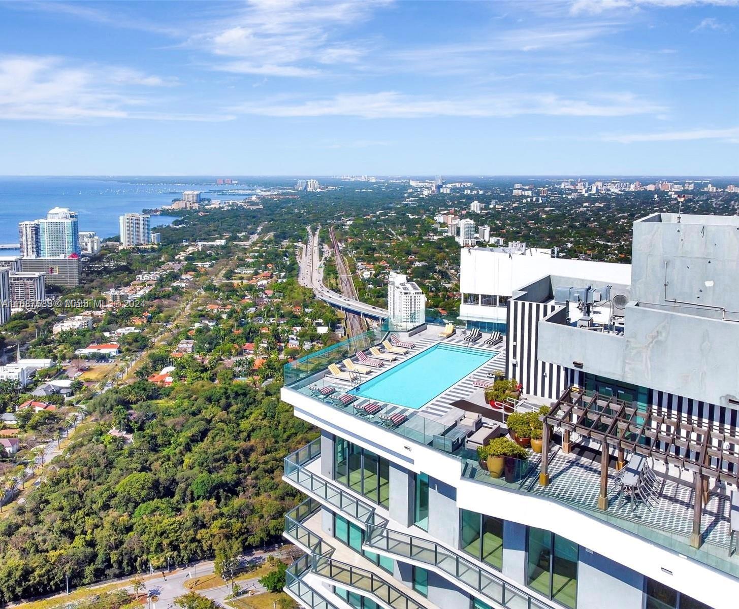 an aerial view of city with balcony