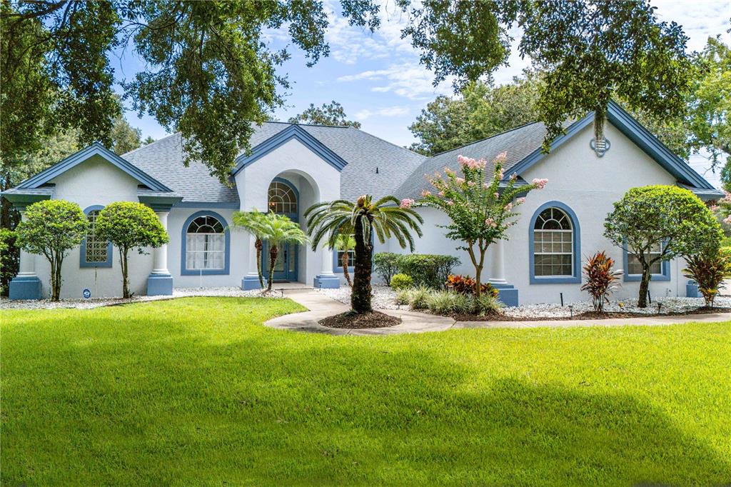 front view of a house with a yard