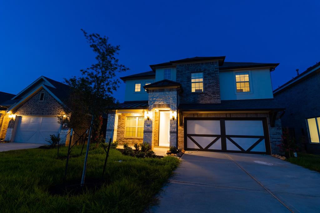 a view of house with outdoor space and garden