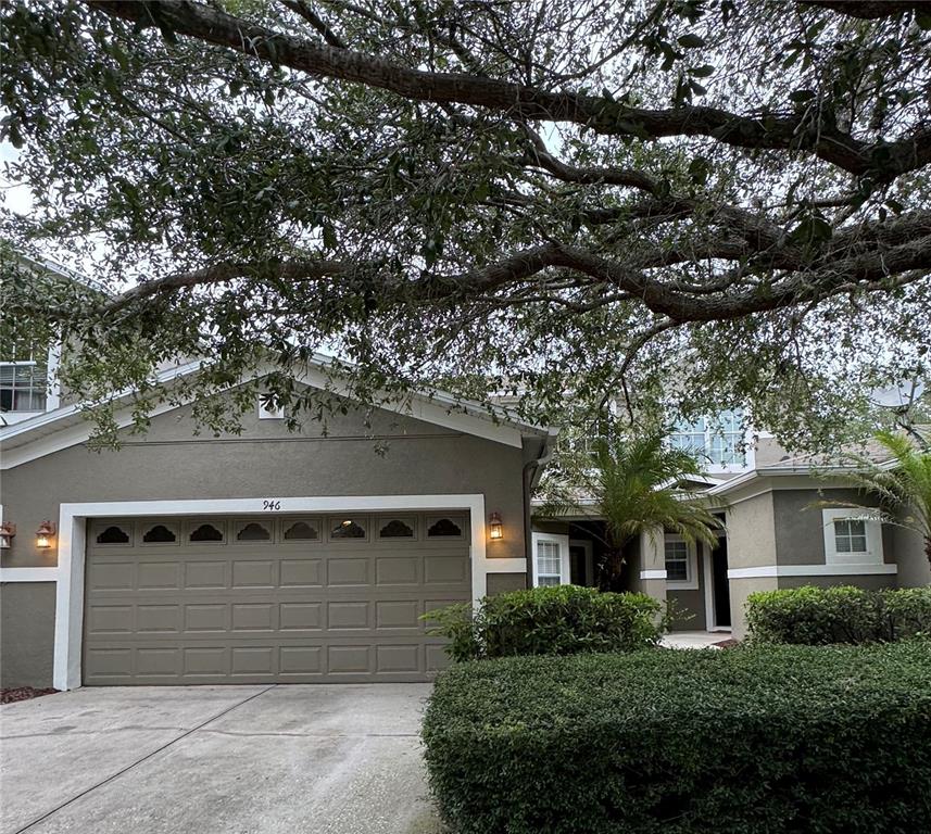 a front view of a house with a garage