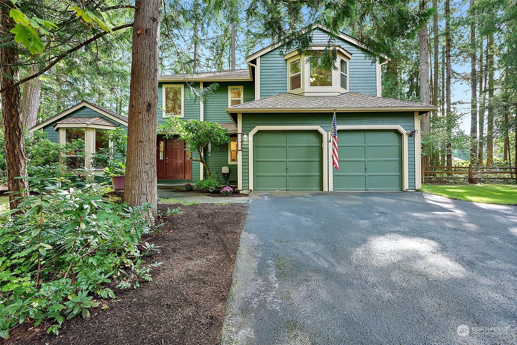 a front view of a house with garden