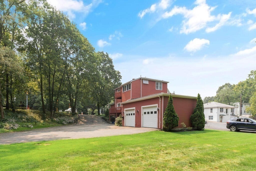 a front view of a house with a yard