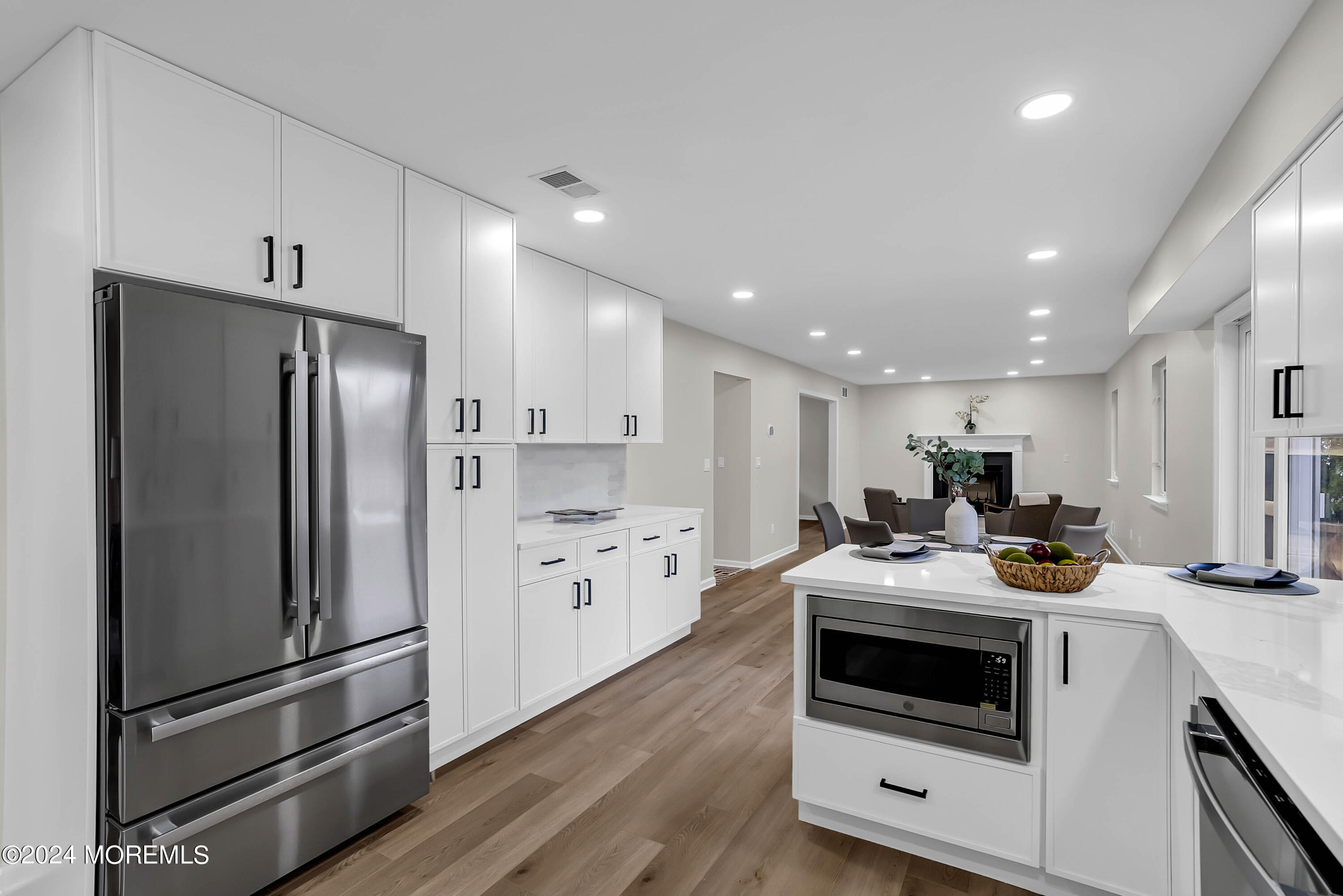 a kitchen with stainless steel appliances a stove a sink and a refrigerator