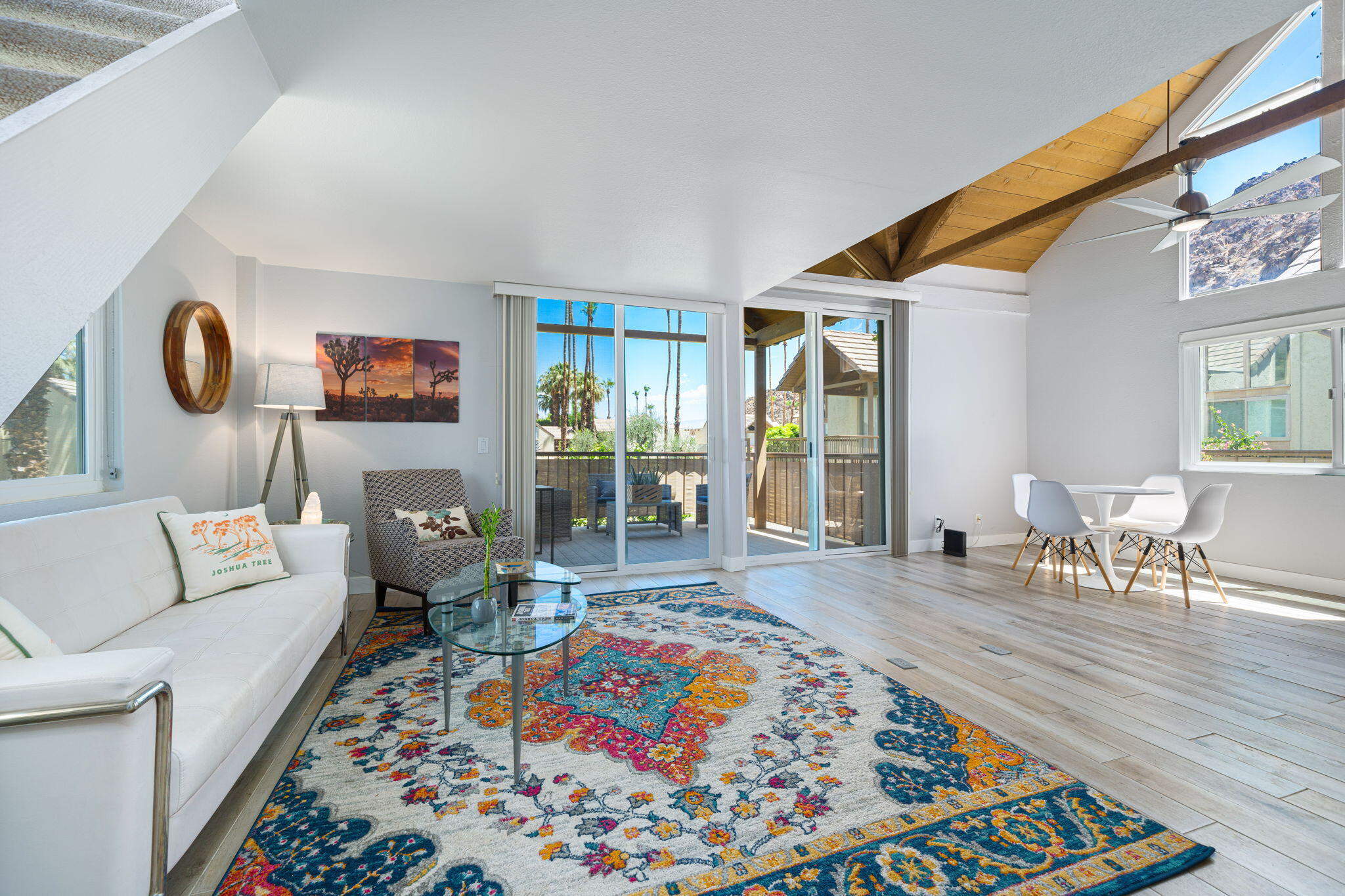 a living room with furniture rug and window