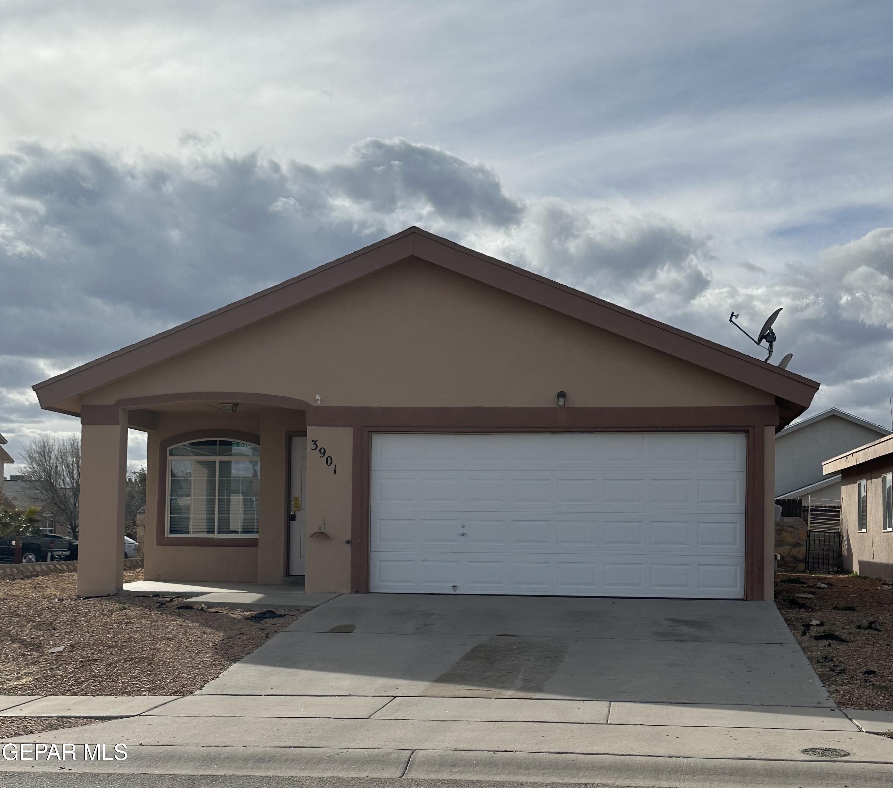 a front view of a house with a garage