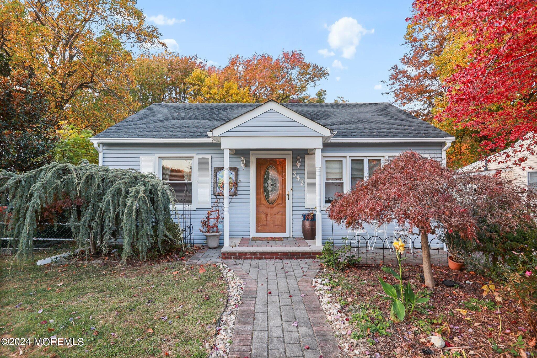 a front view of a house with garden