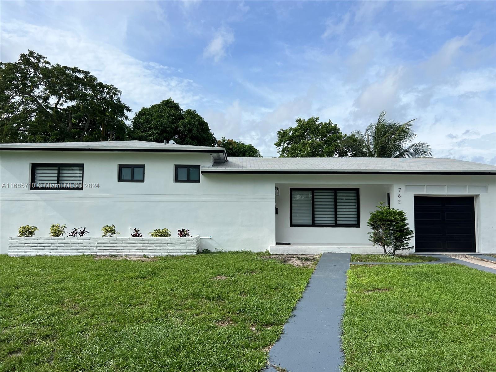 a front view of house with yard