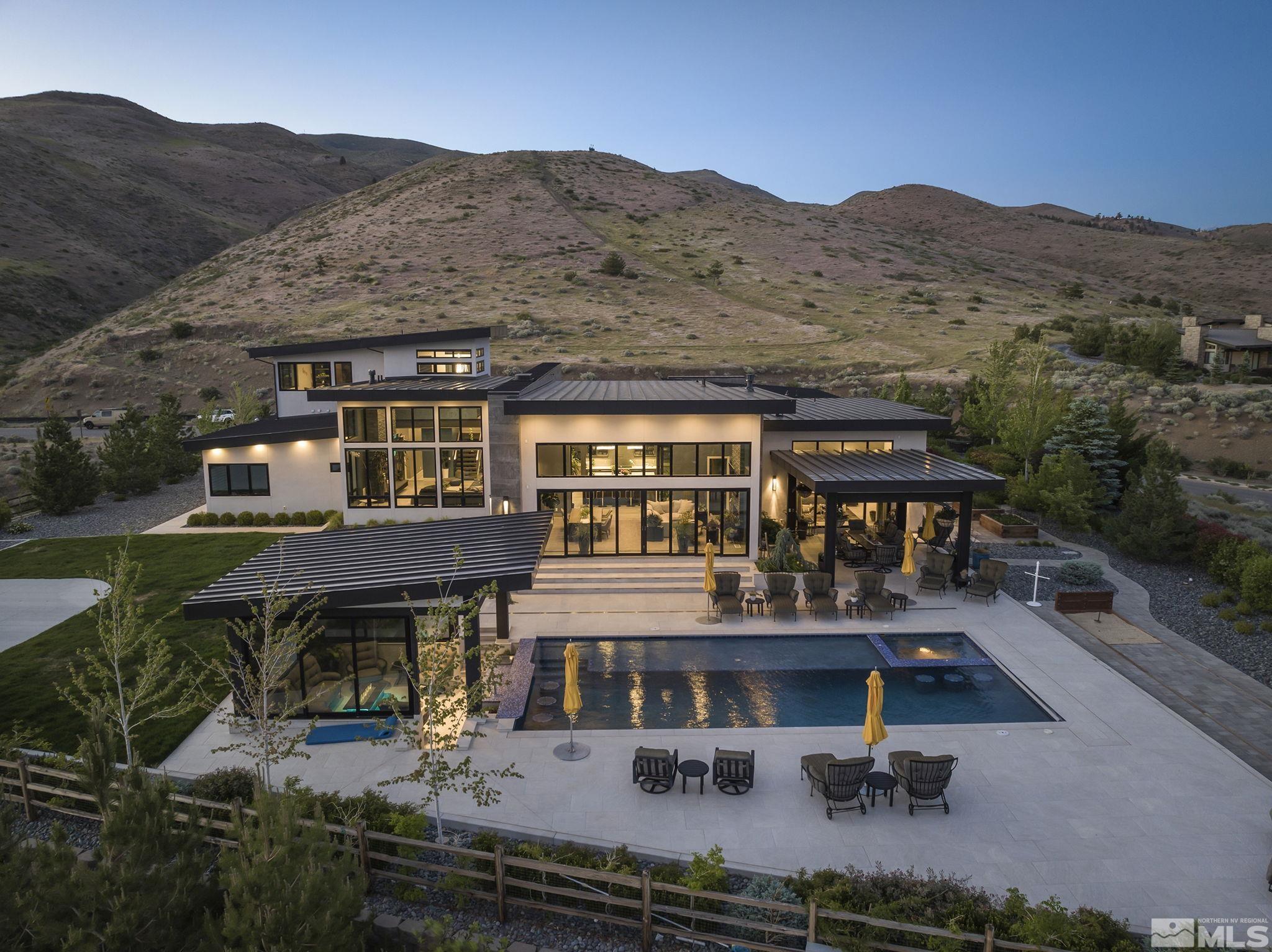 an aerial view of house with yard