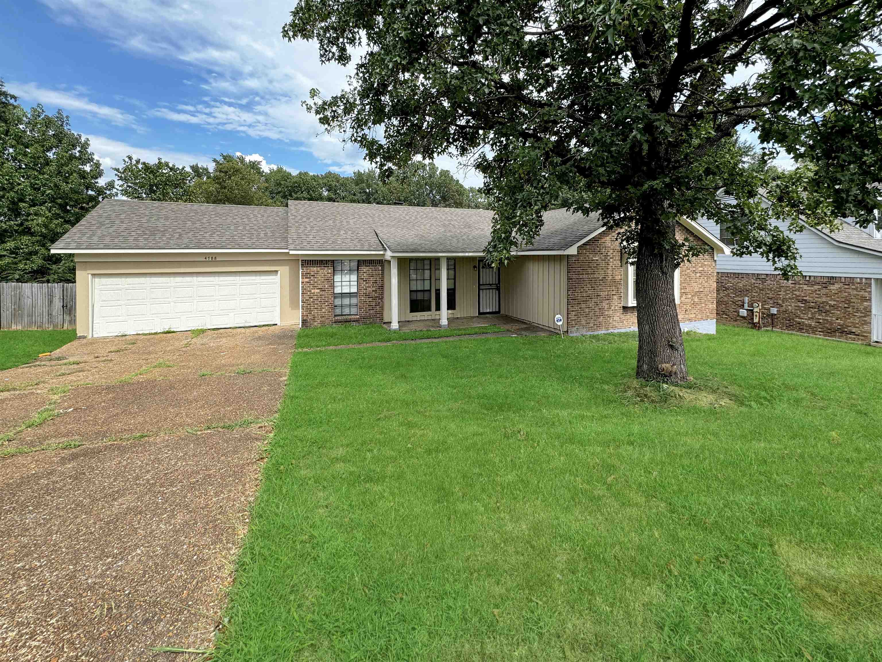 front view of a house with a yard