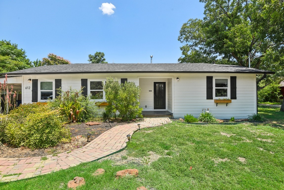 front view of a house with a yard