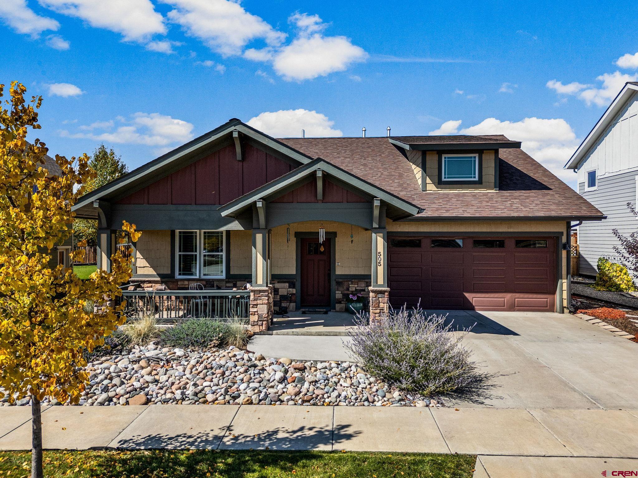 a front view of house with yard outdoor seating and barbeque oven