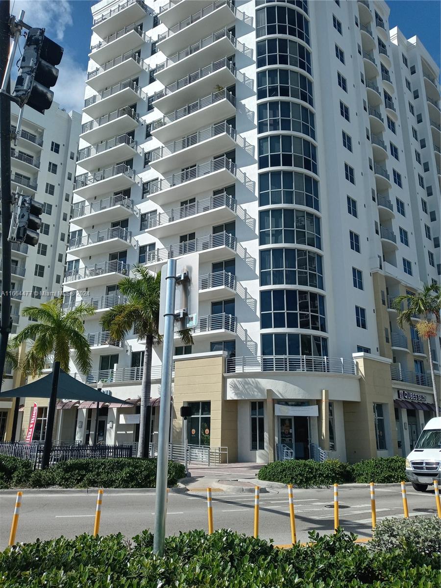 a view of a building with a street