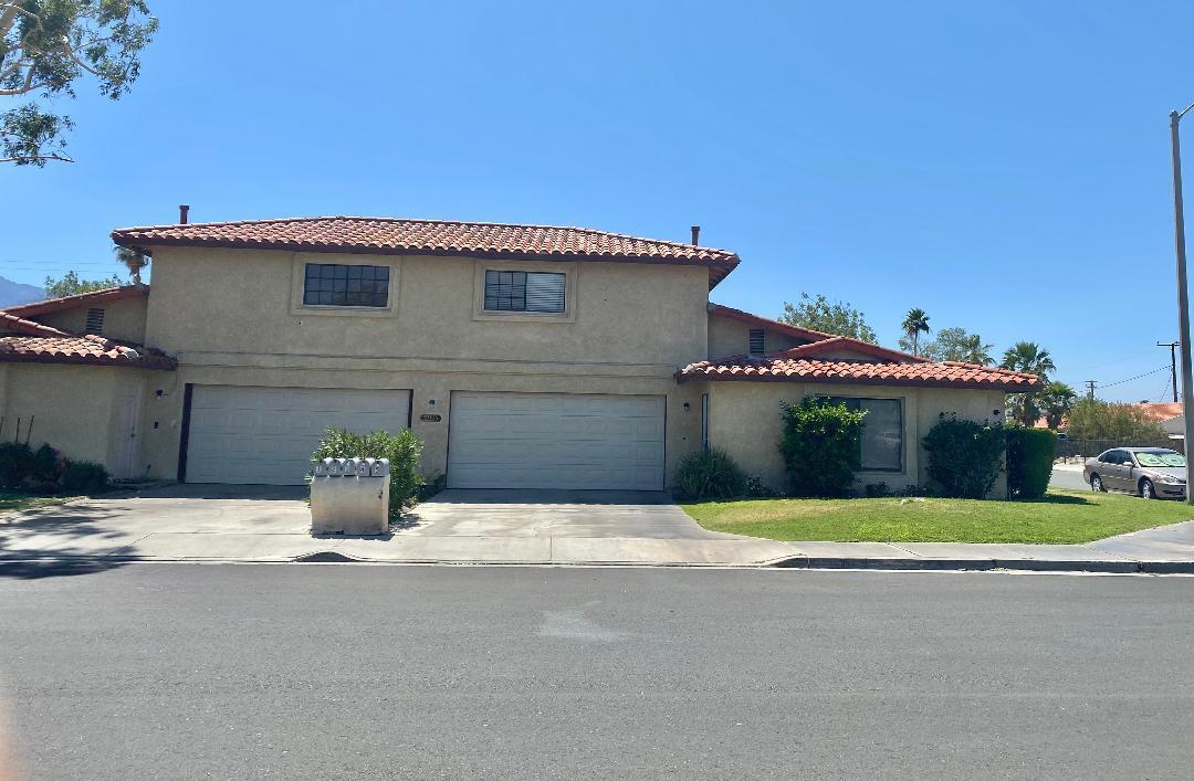 a house with a yard in front of it