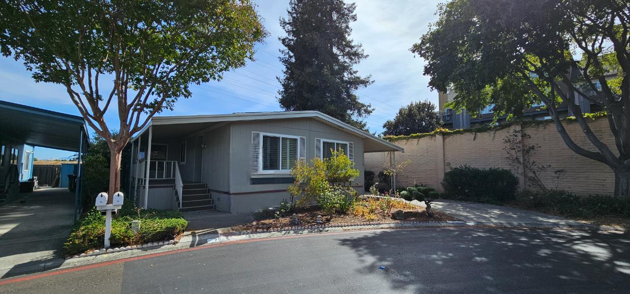 a front view of a house with garden