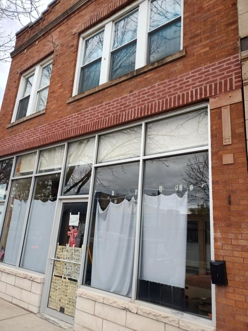 a view of a building with a glass door