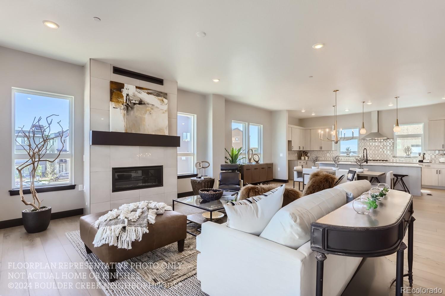 a living room with furniture fireplace and window