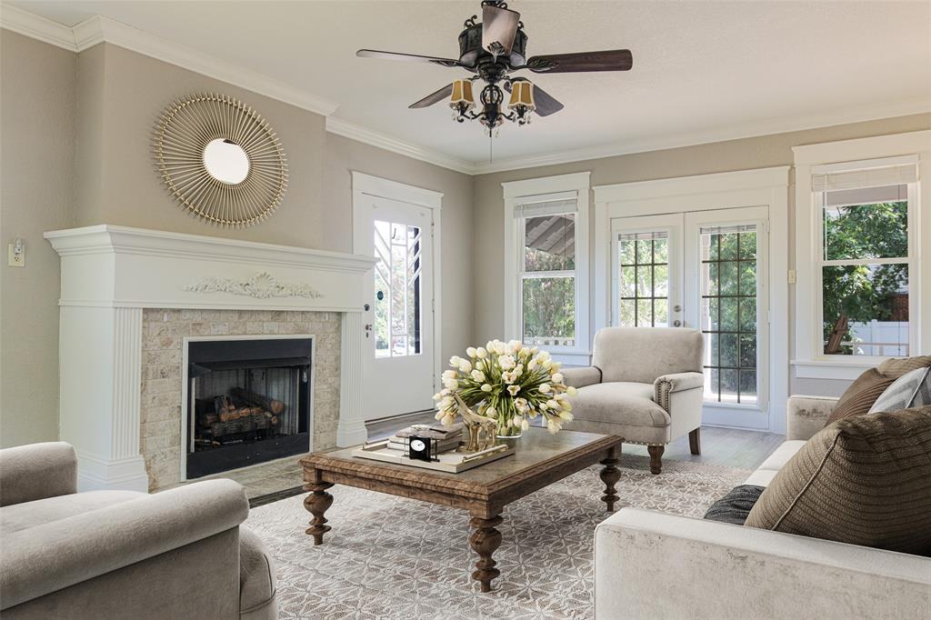 a living room with furniture and a fireplace