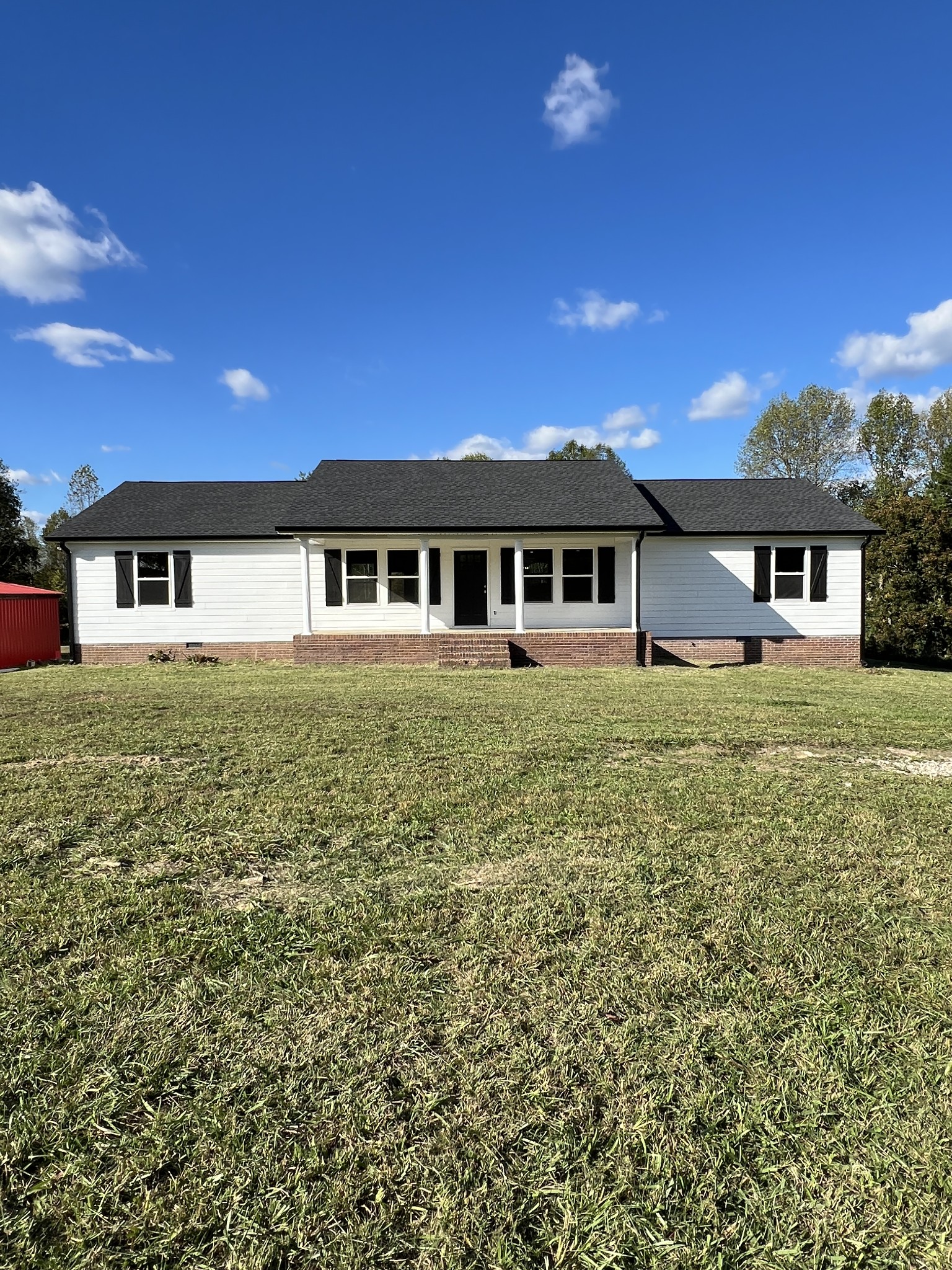 front view of a house with a yard