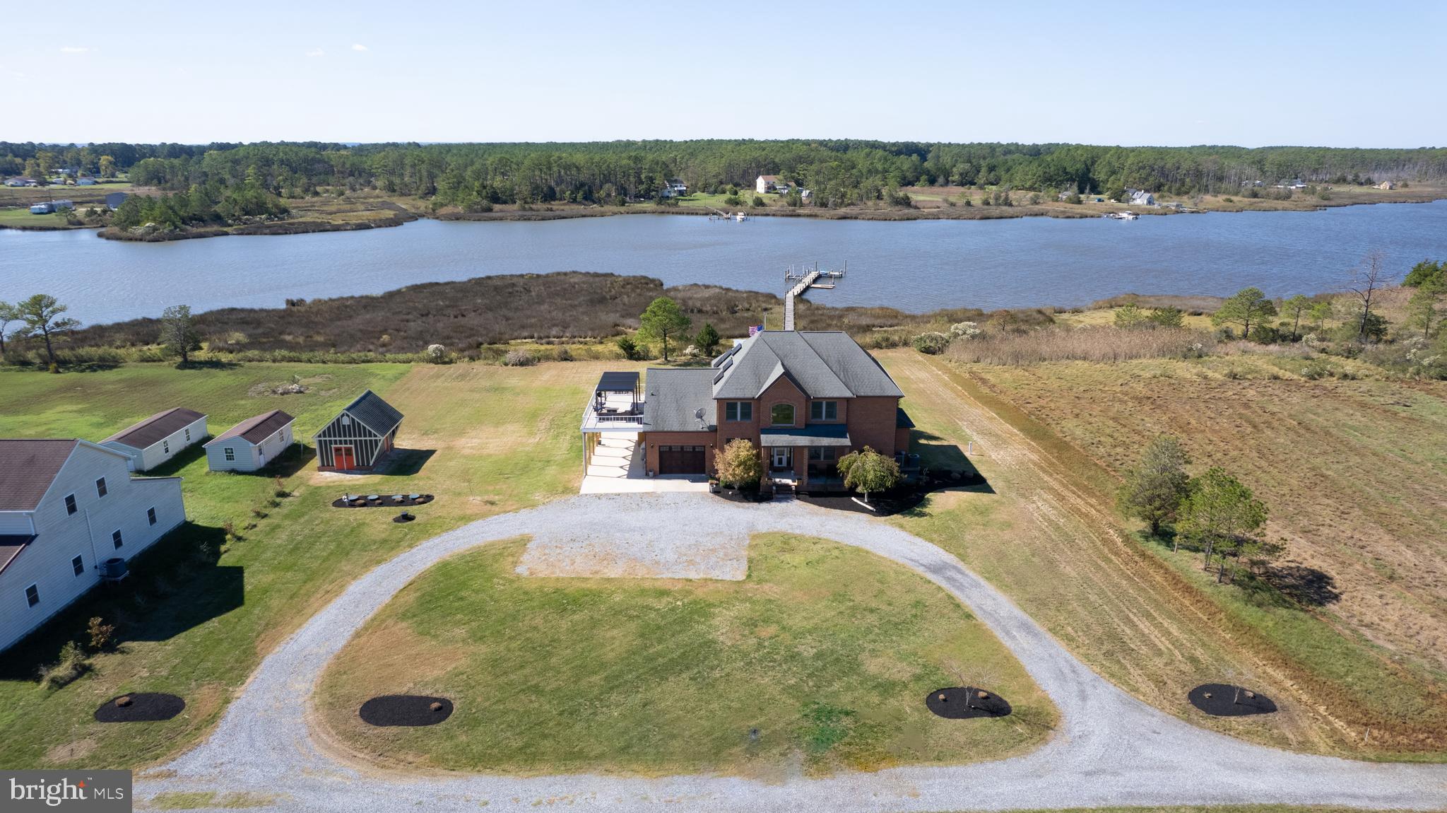 an aerial view of a house with a lake view