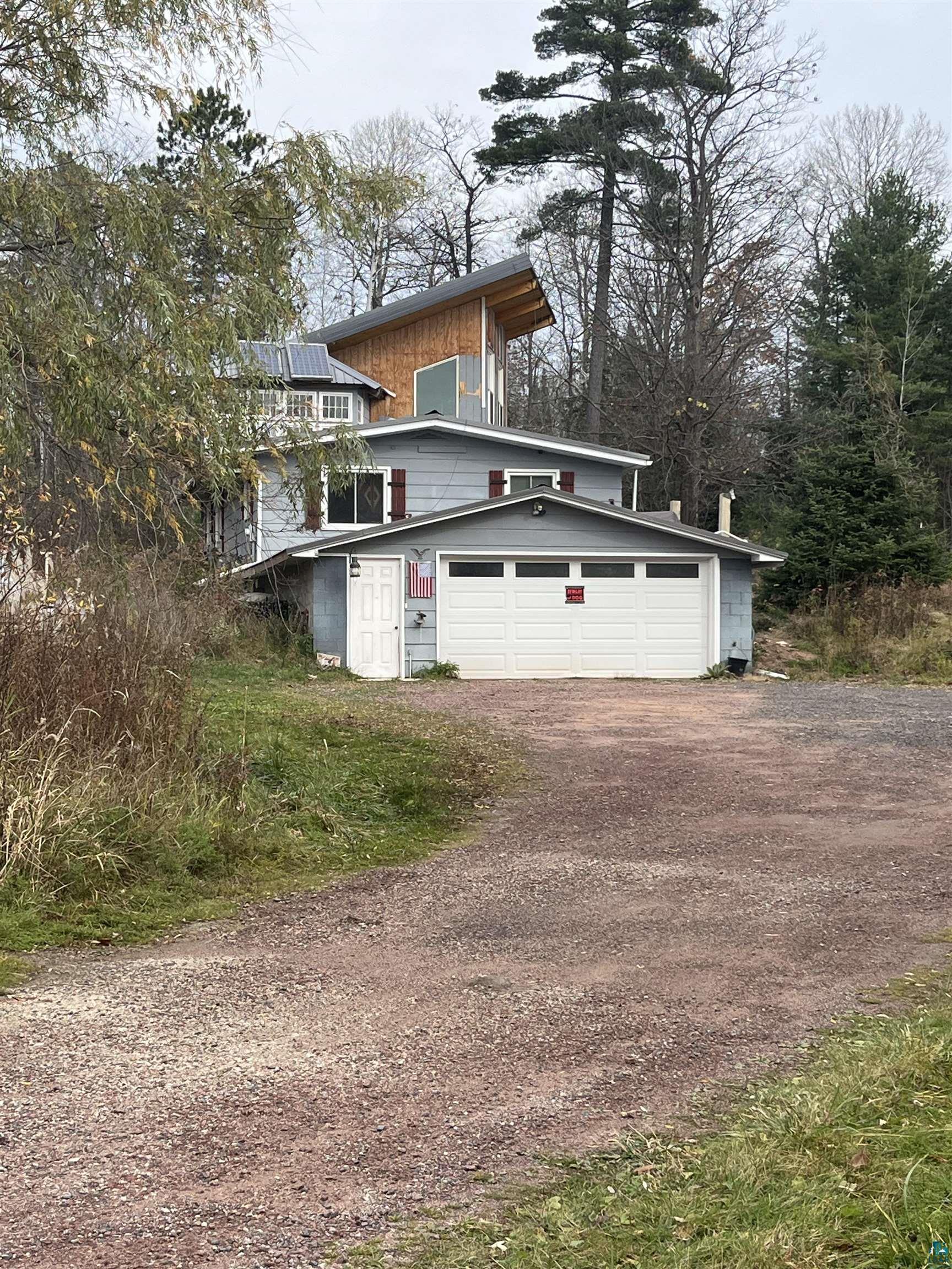 3 car garage with skylights is behind the photographer