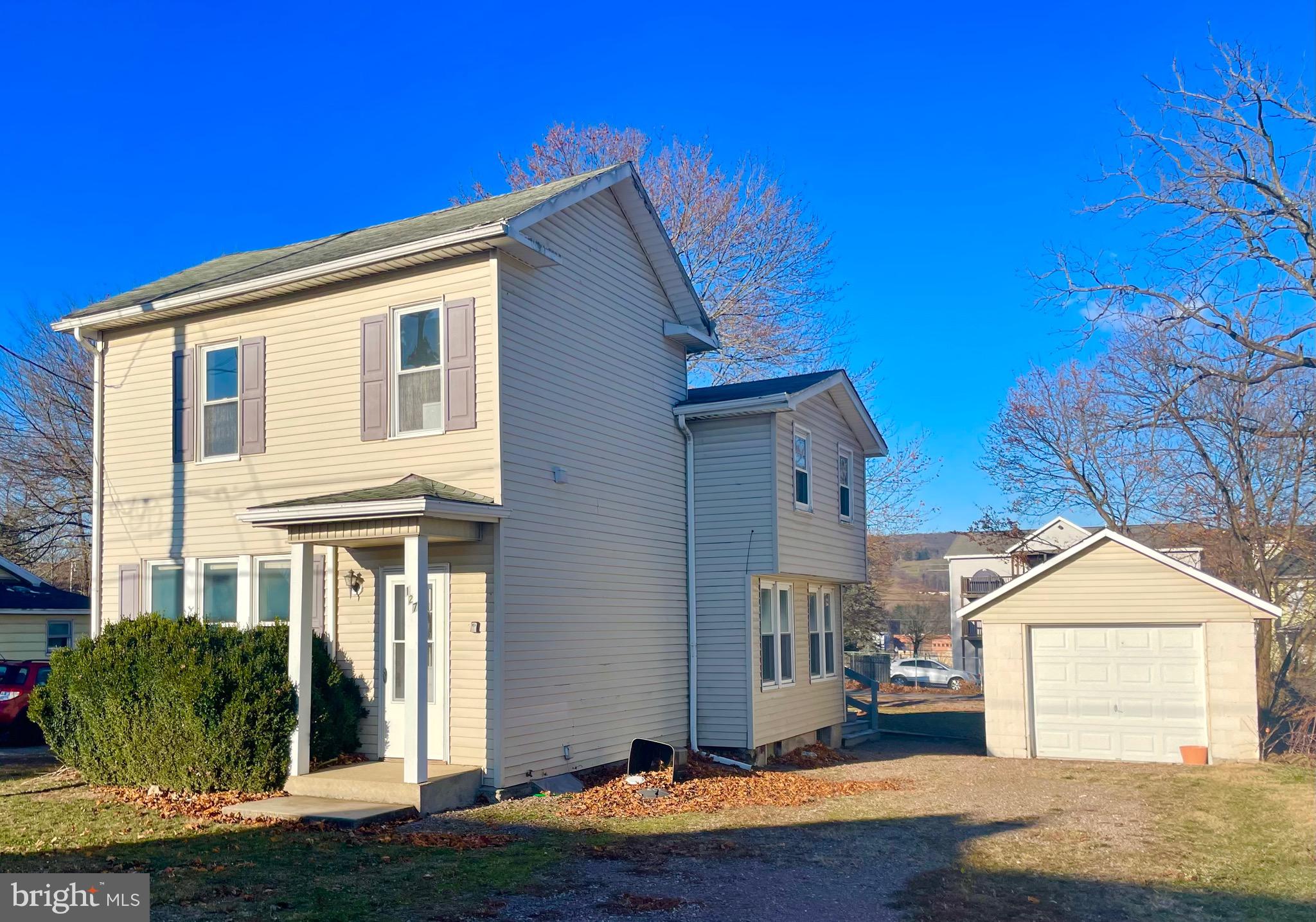 a front view of a house with yard