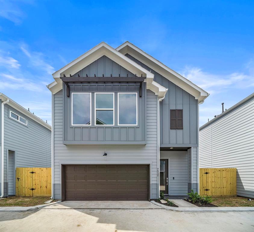 a front view of a house with a garage