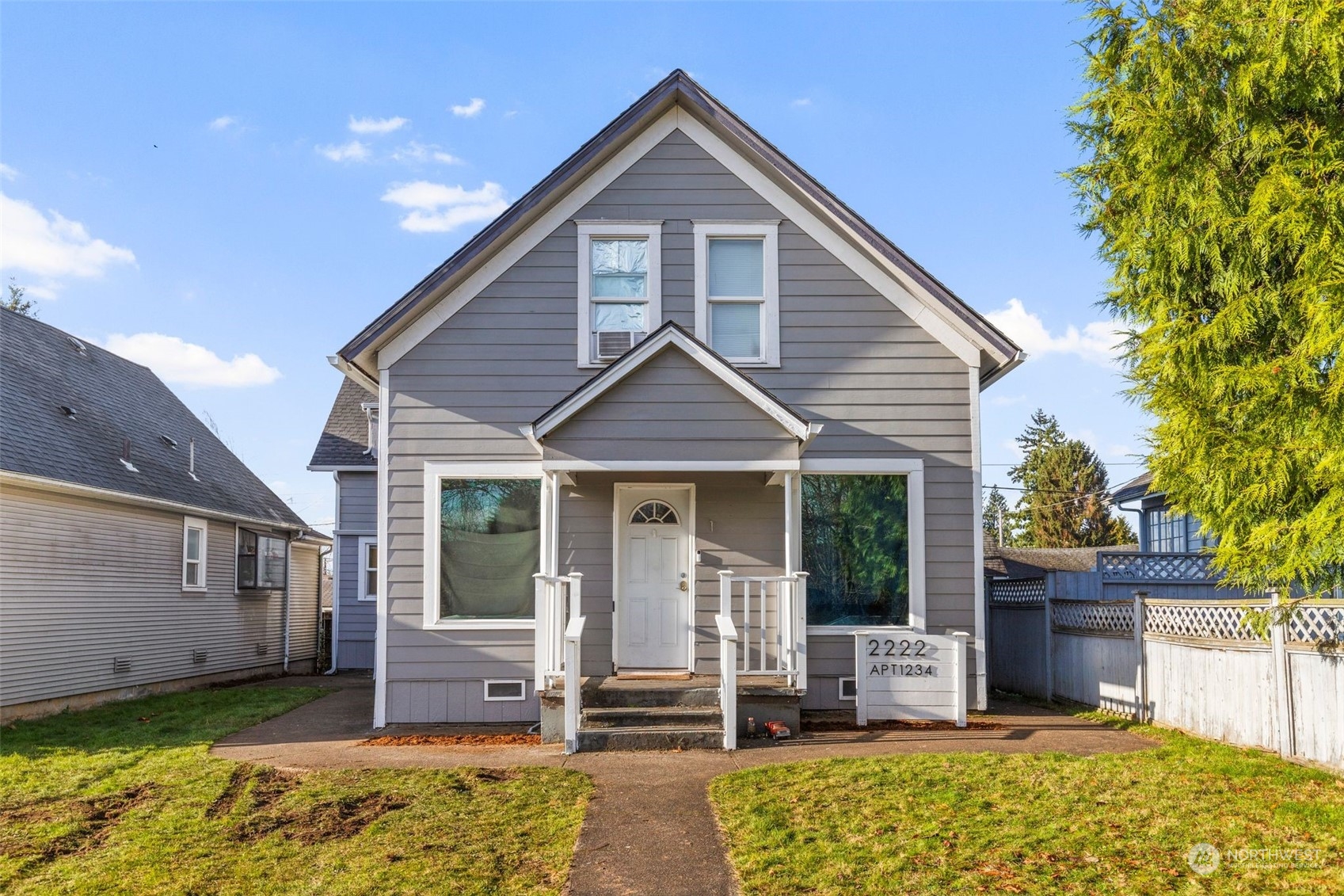 a front view of a house with a yard