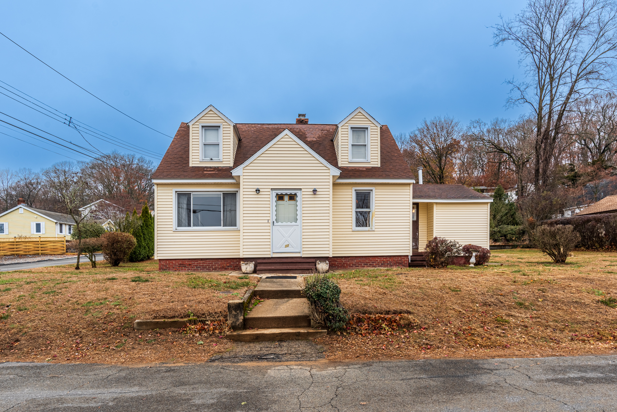 a front view of a house with a yard