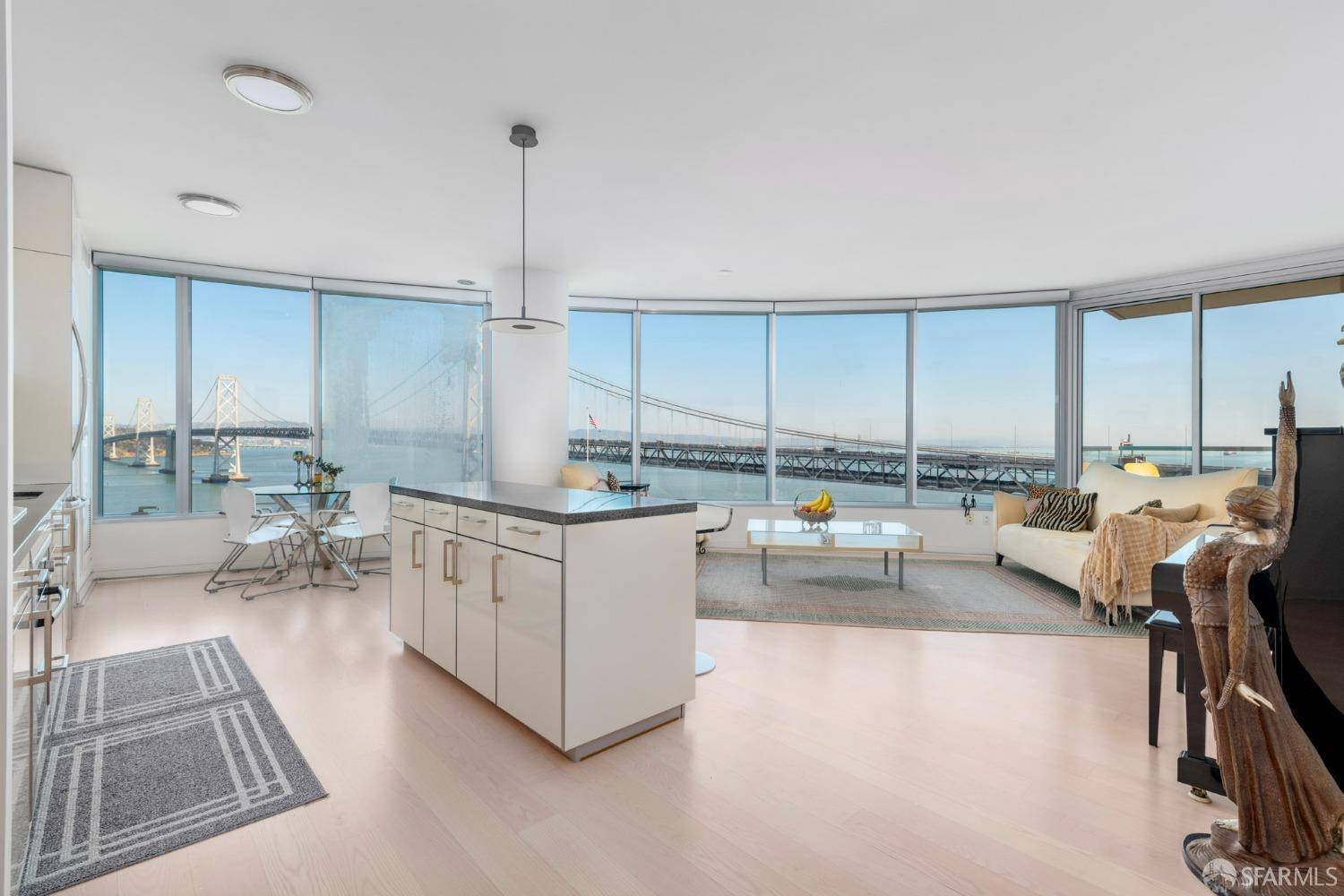 a kitchen with sink refrigerator and cabinets