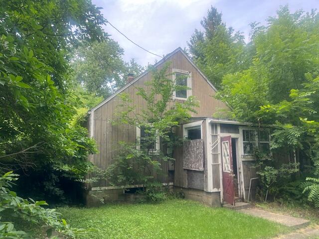 a view of a small house in the garden