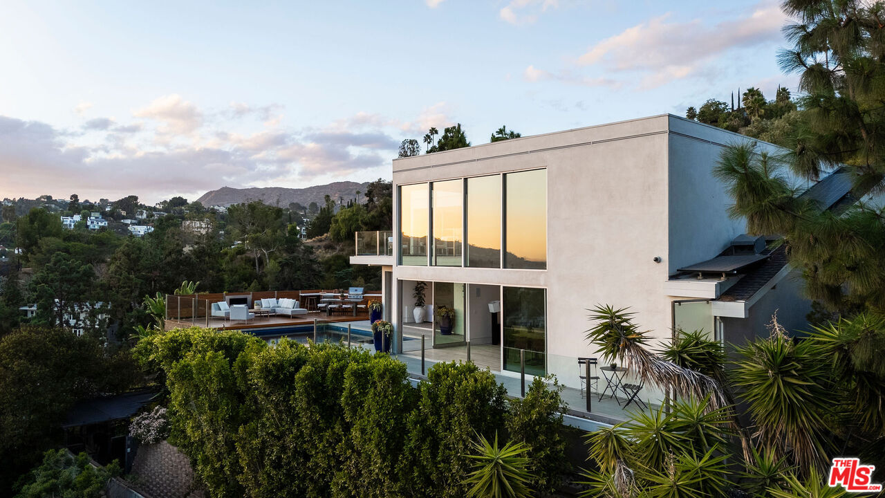 a view of a house with outdoor space and balcony