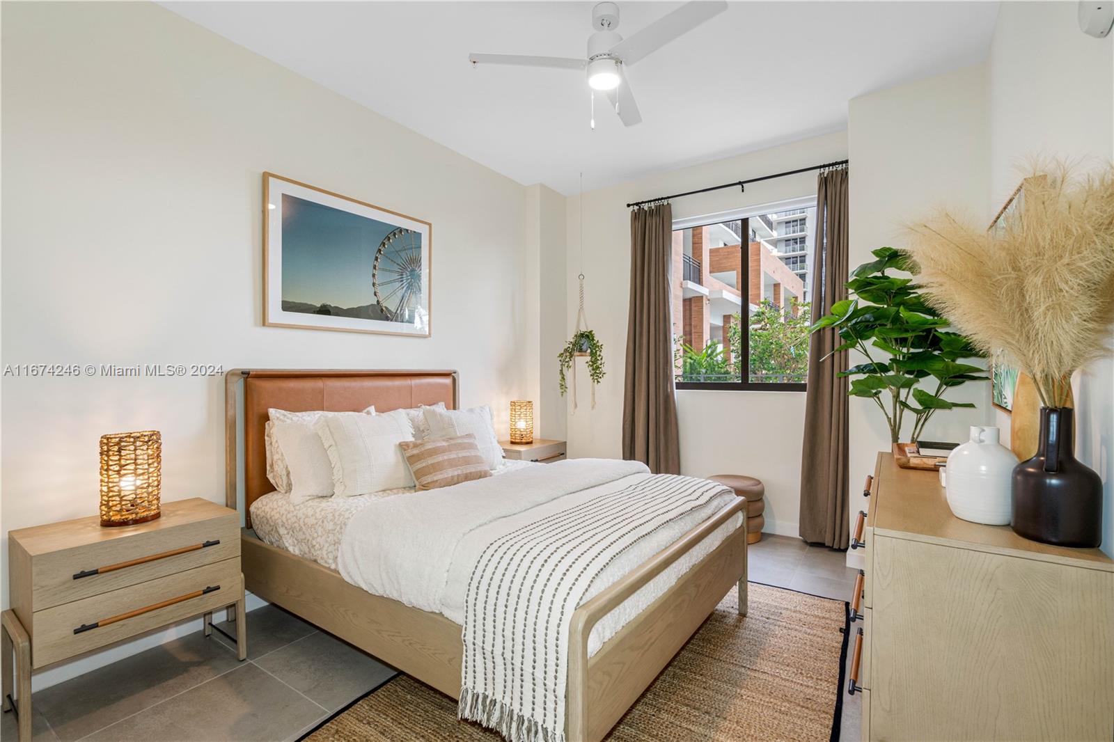 a bedroom with a bed and a potted plant