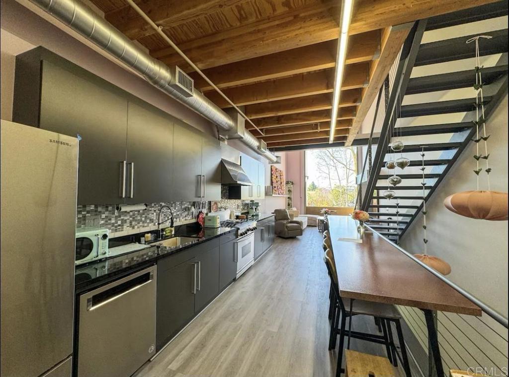 a kitchen with a stove and a refrigerator