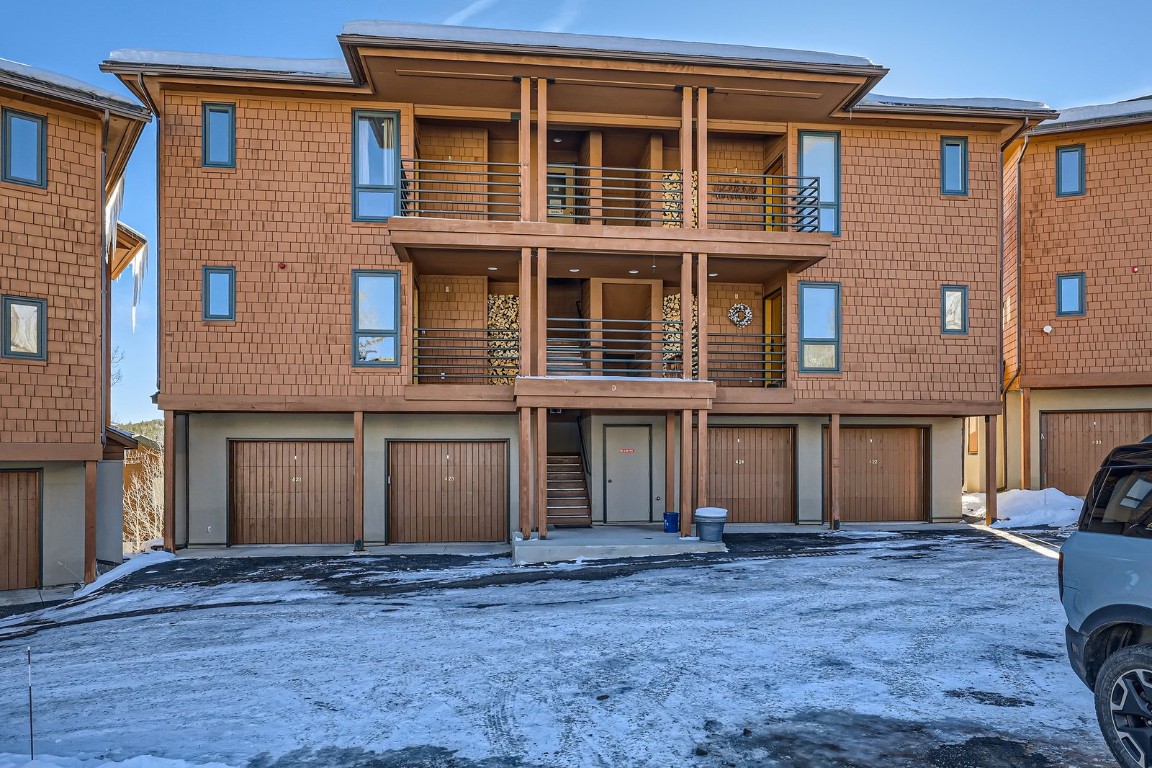 View of front of house featuring a balcony