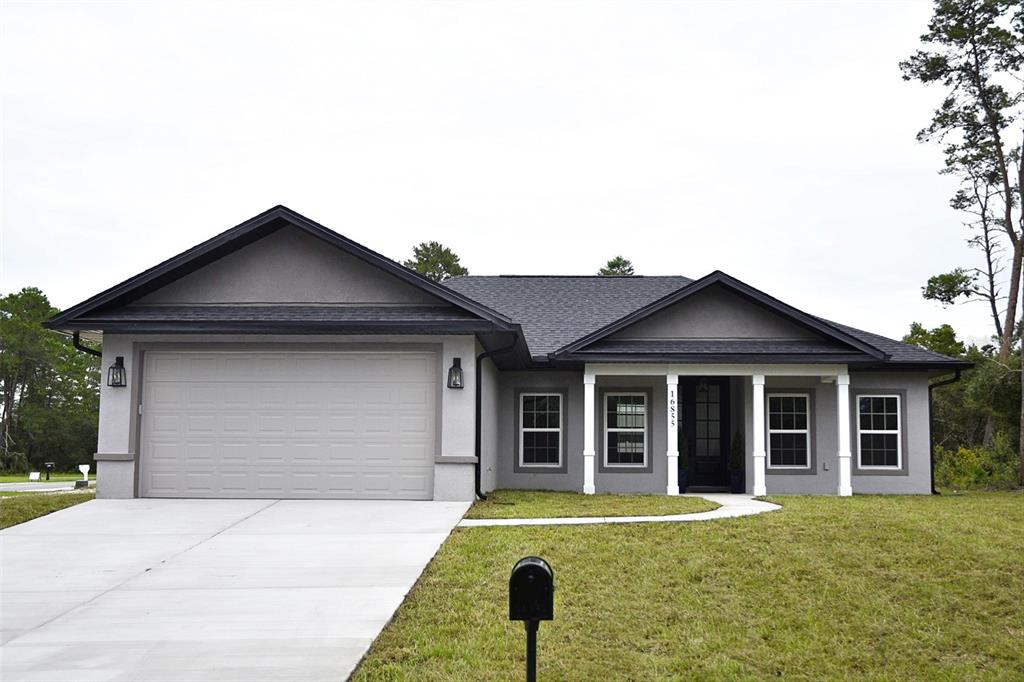 front view of a house with a yard