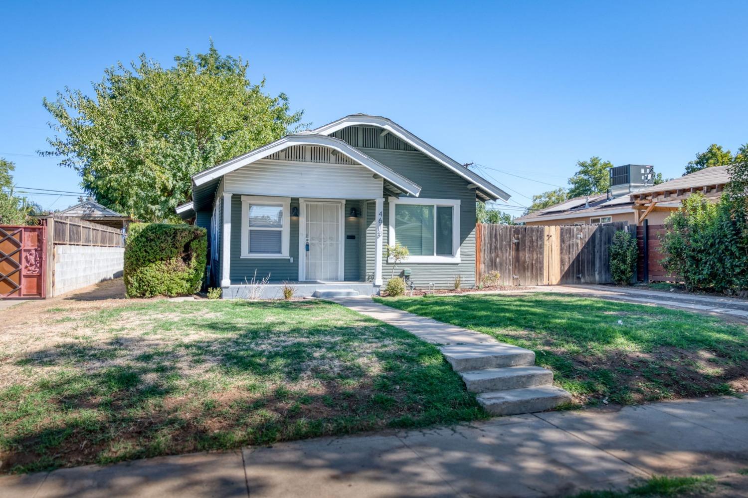 a front view of a house with yard