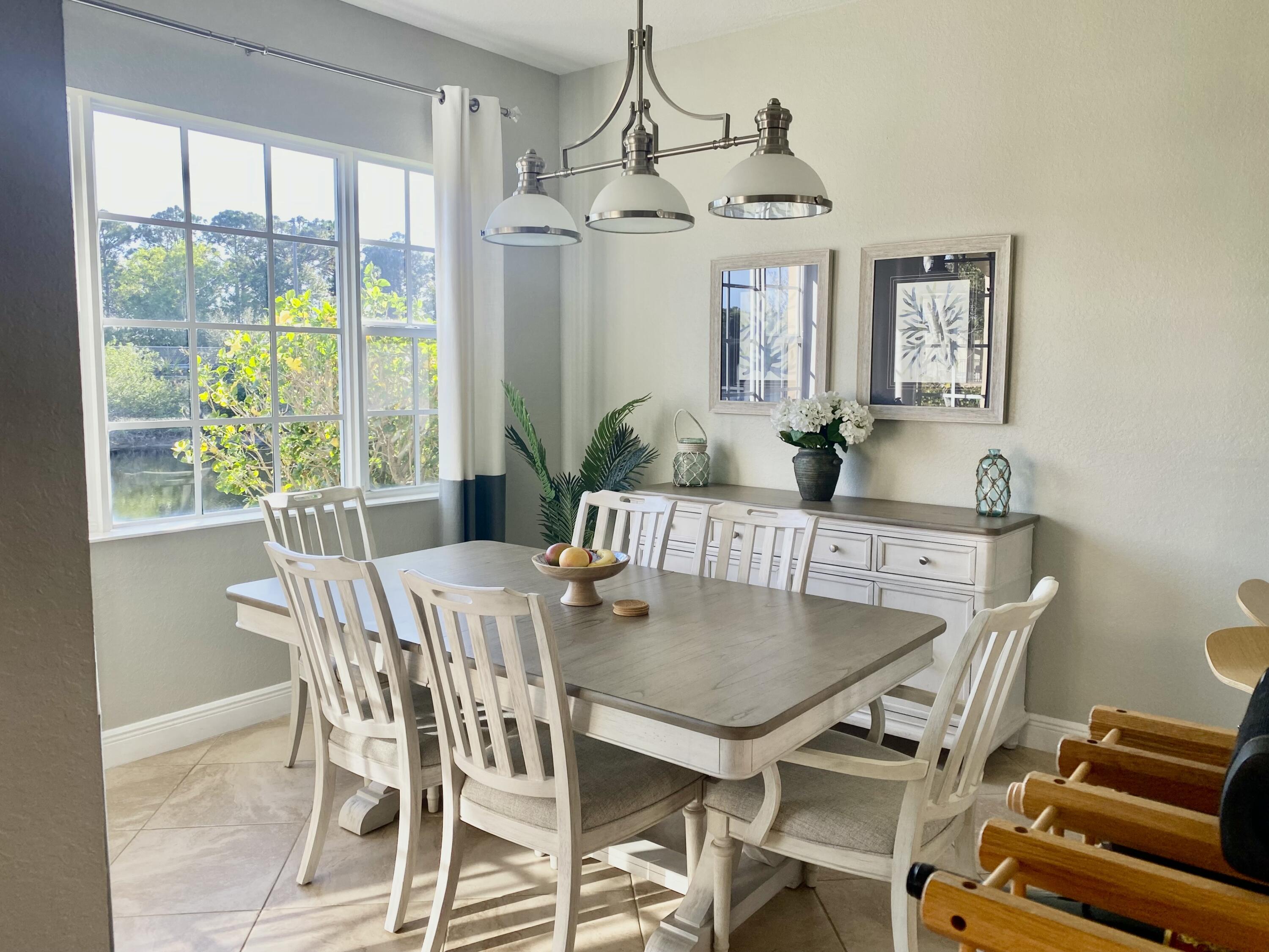 a view of a dining room with furniture window and outside view