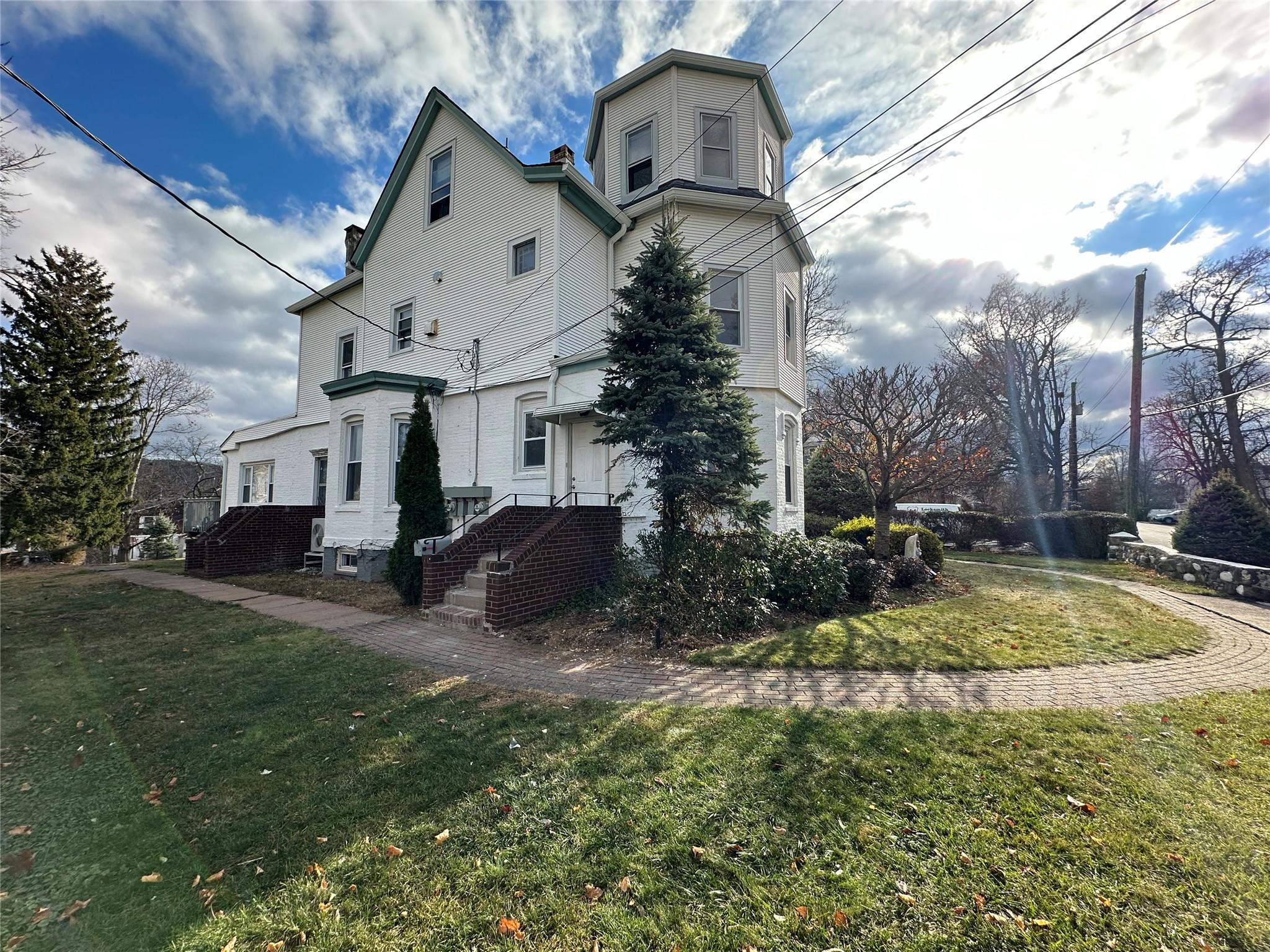 a view of house with yard