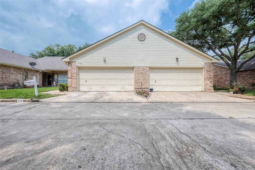 a view of garage and yard